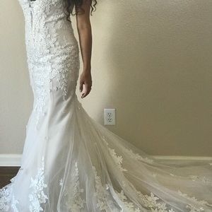 Wedding dress never worn. Tags still on